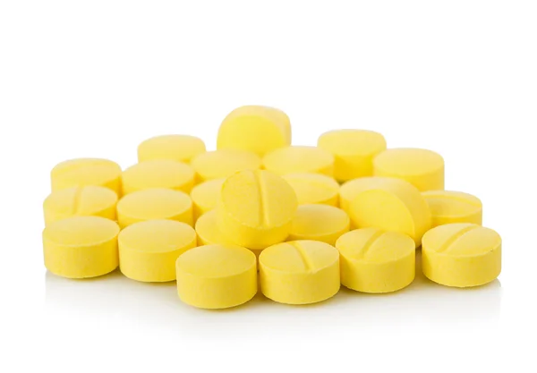 Tabletta sárga elszigetelt fehér background — Stock Fotó