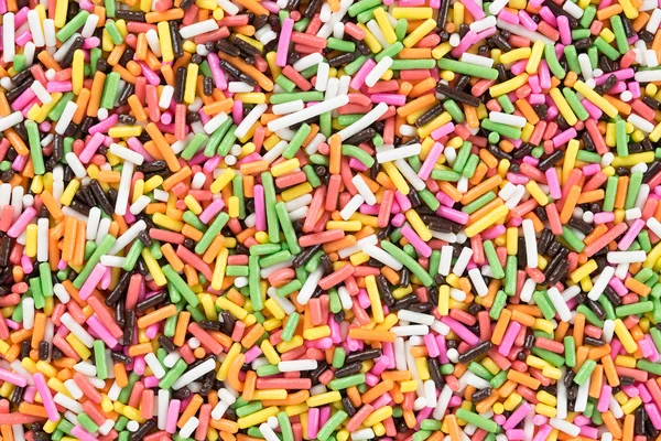 Colorful candy sprinkles background. Top view — Stock Photo, Image