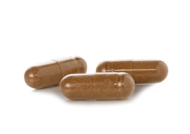 Beyaz arka planda kapsül hapları