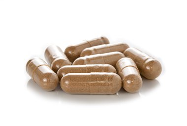 Beyaz arka planda kapsül hapları