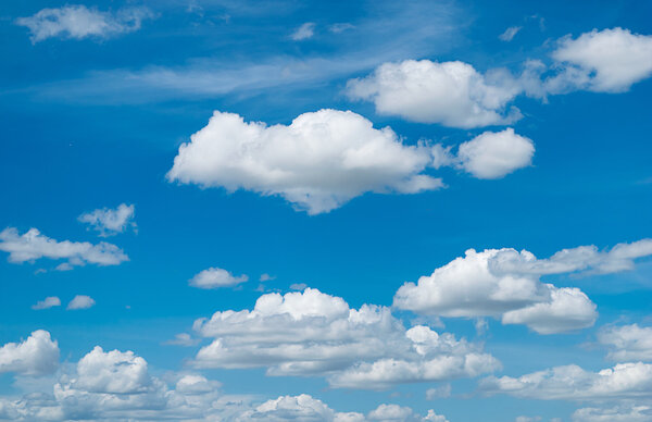 blue sky background with tiny clouds