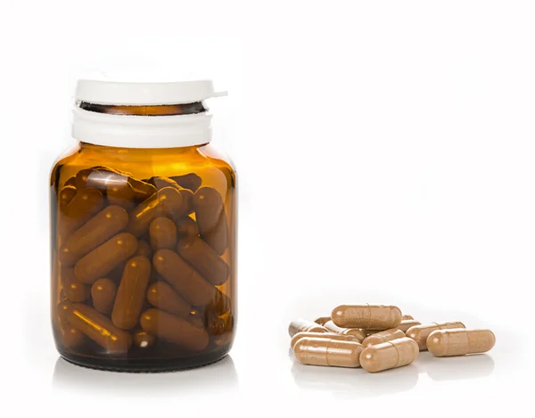 Pills from bottle on white background — Stock Photo, Image