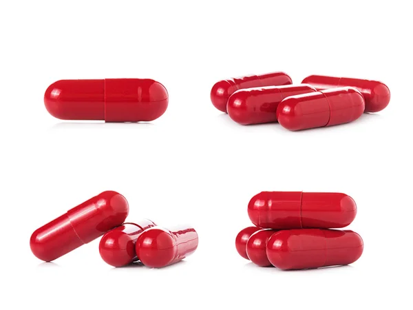 Red pill capsules on white background — Stock Photo, Image