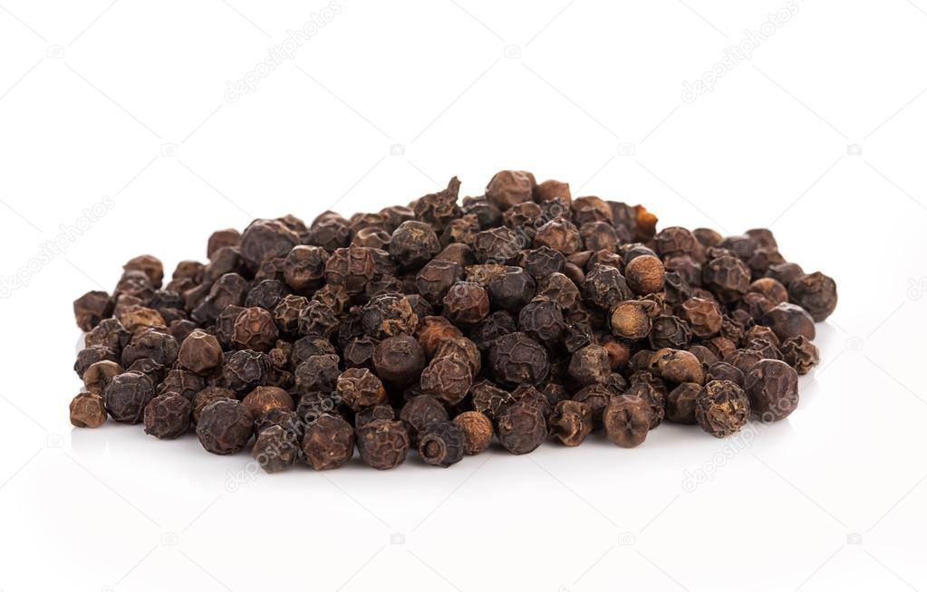 black peppers on the white background