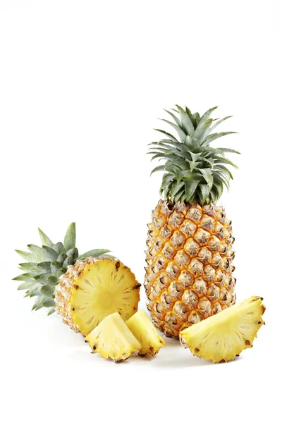 Pineapple with slices on white background. — Stock Photo, Image
