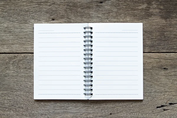 Notebook on wooden background — Stock Photo, Image