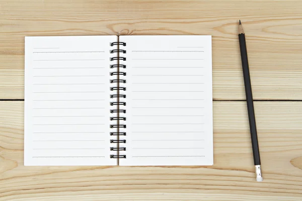Notebook and pencil on wooden background. — Stock Photo, Image