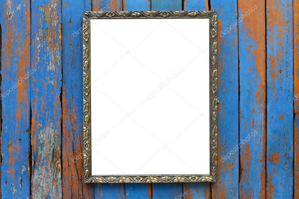 Old wooden picture frame on wooden background.