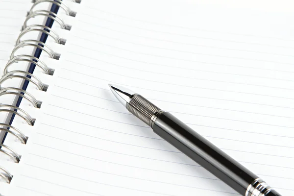 Notebook with black pen — Stock Photo, Image