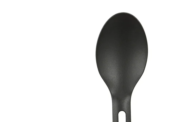 Black spoon on isolated white — Stock Photo, Image