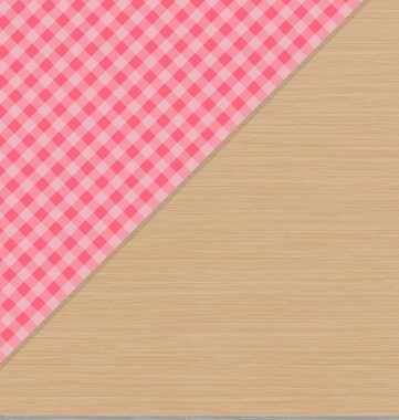 Hafif kahverengi ahşap masa üzerinde pembe kareli masa örtüsü