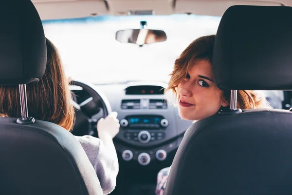 Two girls friends in car