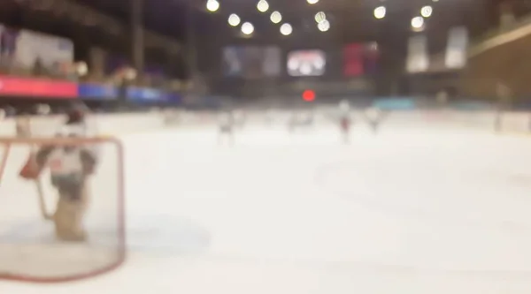 blurred ice hockey in indoor stadium