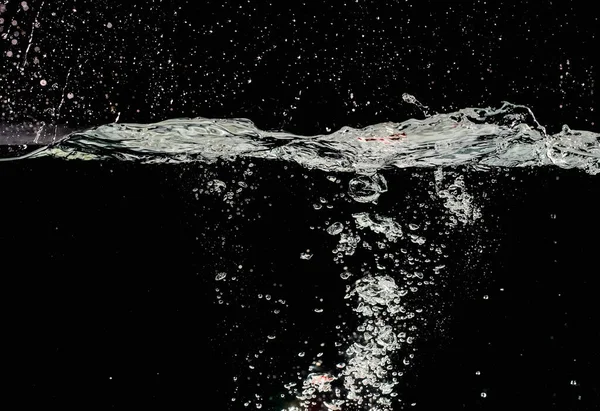 water splash and bubbles wave on black background