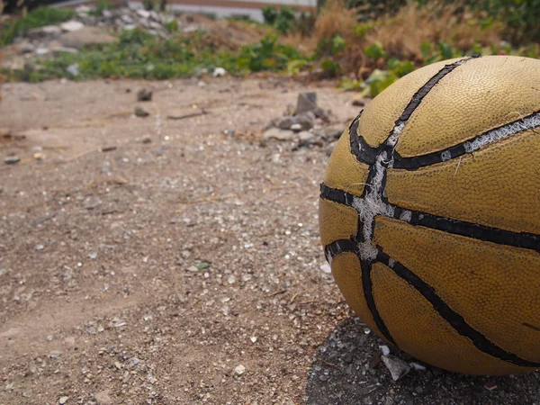 old basketball on the ground, with copy space