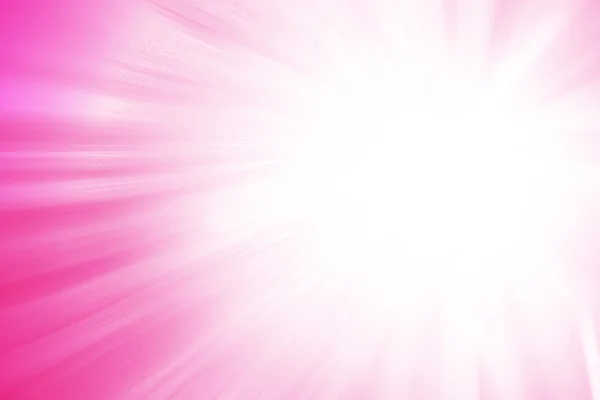 Pembe glitter ışıltı ışınları ışık arka plan defocused.
