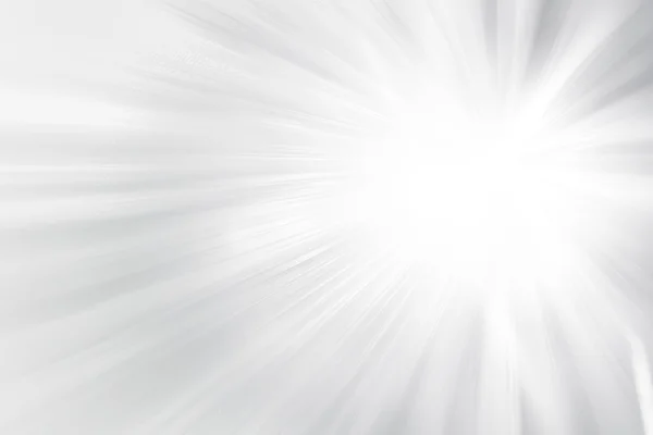 Gri glitter ışıltı ışınları ışık arka plan defocused.