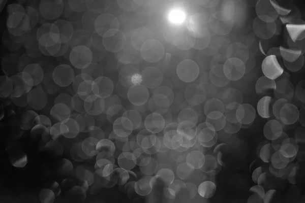 Černá ray bokeh třpytky rozostřeného světla abstrakt — Stock fotografie