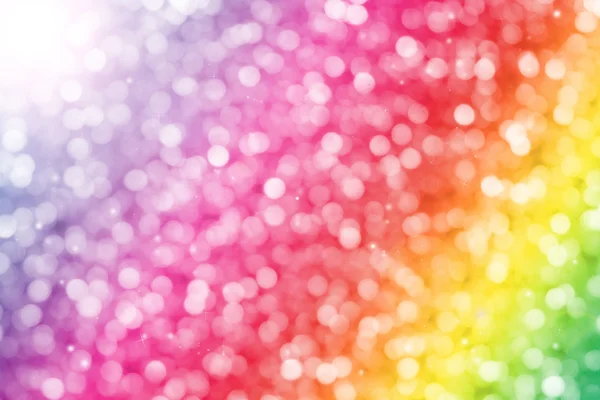 Kleurrijke glitter sparkle intreepupil stralen lights bokeh abstracte achtergrond. — Stockfoto