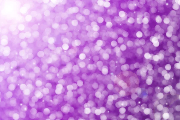 Paarse glitter sparkle intreepupil stralen lights bokeh — Stockfoto