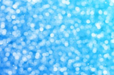 Mavi glitter ışıltı ışınları ışıklar bokeh arka plan defocused.