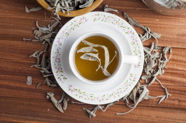 Dry sage tea on a wooden background — Stock Photo, Image