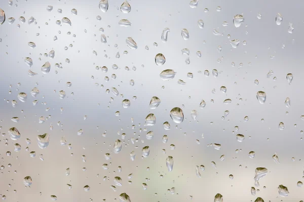 Abstruct kapky deště na okenní sklo — Stock fotografie