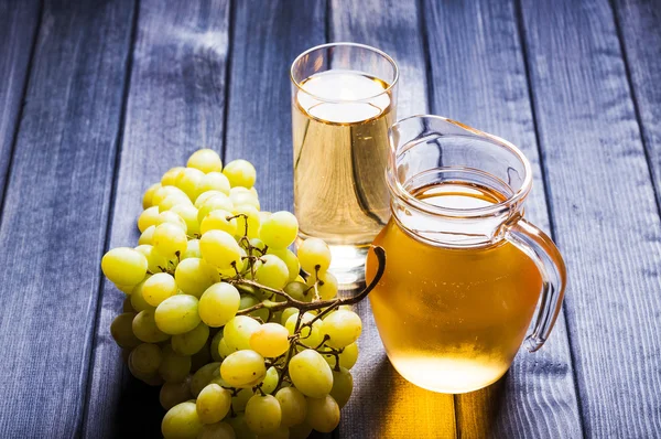 Grape juice in the glass and pitcher — Stock Photo, Image