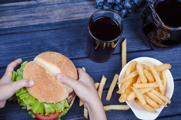 Hamburger in hands top view — Stock Photo, Image