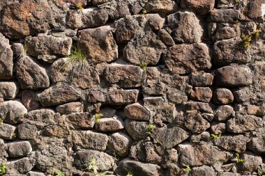 Arka plan. Eski kalenin taş duvar