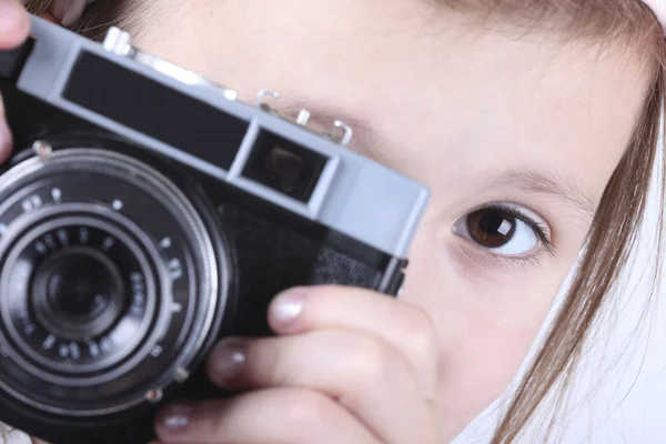Portrait of a girl with camera on white background — Stock Photo, Image
