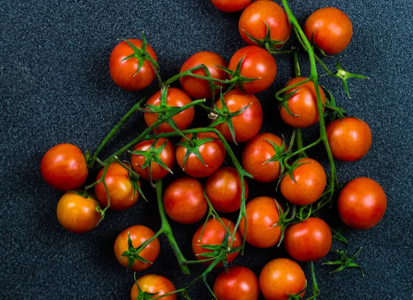 Tomatoes against a dark background — Stock Photo, Image