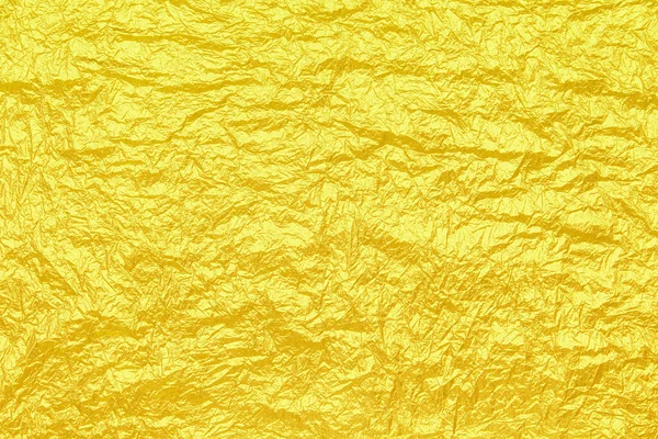 喜庆的黄色折皱了的铝箔.你的设计背景. — 图库照片