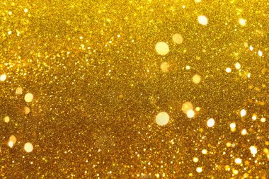 Shiny iridescent gold background with tints and lights. Golden Christmas tinsel background clipart