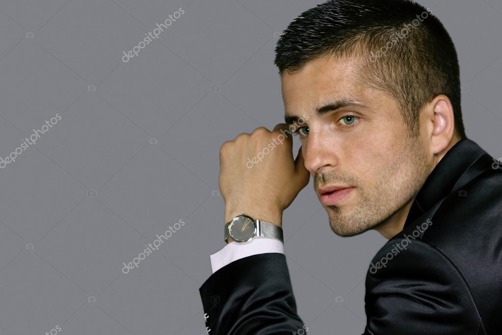 Handsome young man wears a watch Stock Photo by ©andre2013 85230588