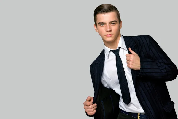 Junger Mann in modischem Anzug und Krawatte, Atelier — Stockfoto