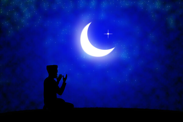silhouette of muslim  at sunset.
