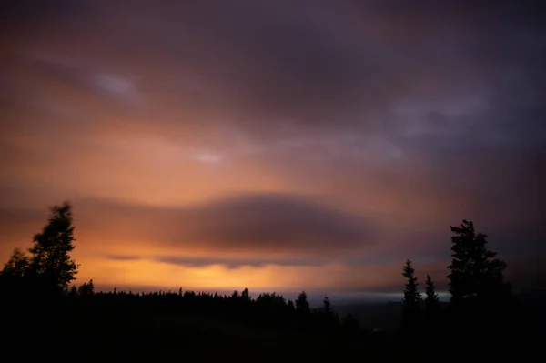 Starry sky and clouds in the carpathian mountains at night