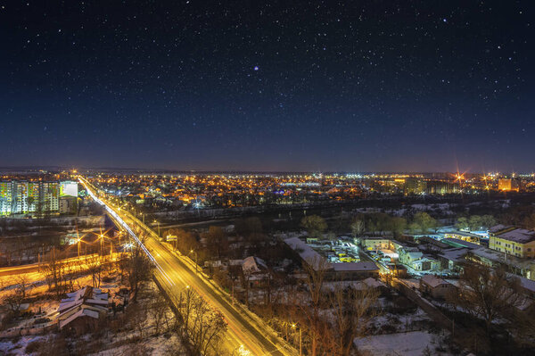 Stars in the sky over the night city in Ukraine