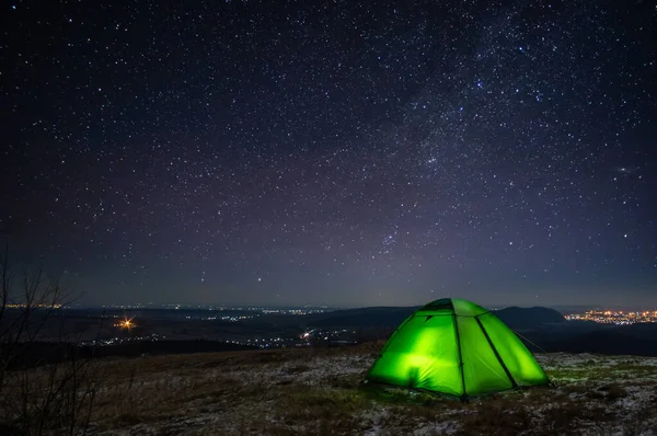 stock image Night on the top of the mountain in winter against the background of the starry sky