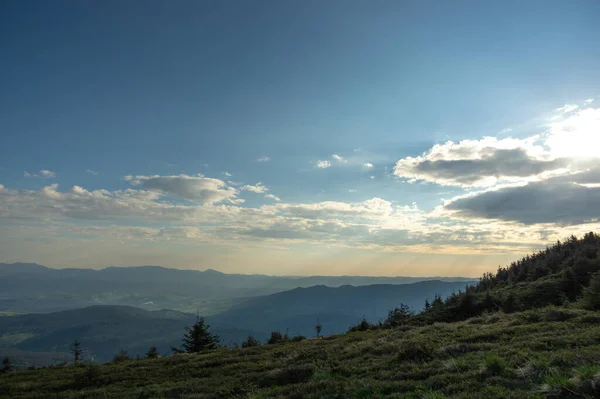 Sun rays at dawn. Rest and travel in the mountains. Morning landscape in Ukraine