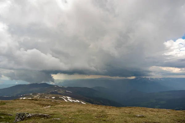 Rain cloud and rain wall in the carpathian mountains in summer