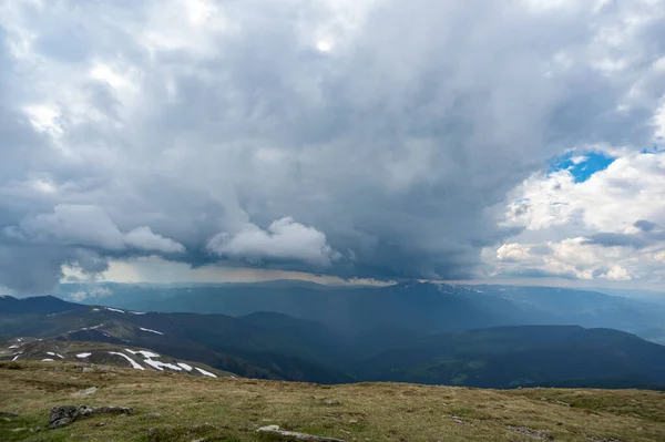 Rain cloud and rain wall in the carpathian mountains in summer