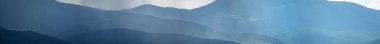 Sun rays and rain in the carpathian mountains in summer, beautiful landscape