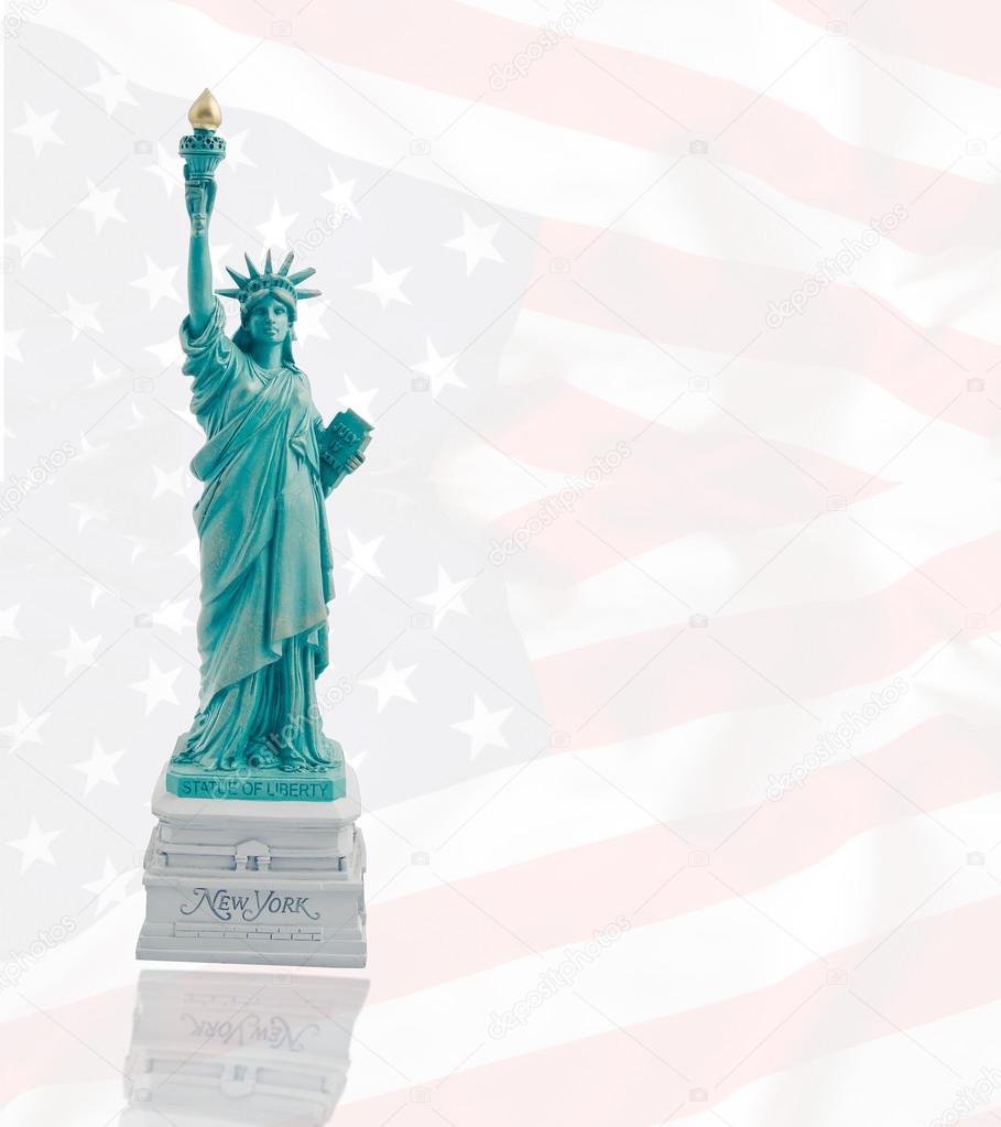 Statue of Liberty on the background of bright flag