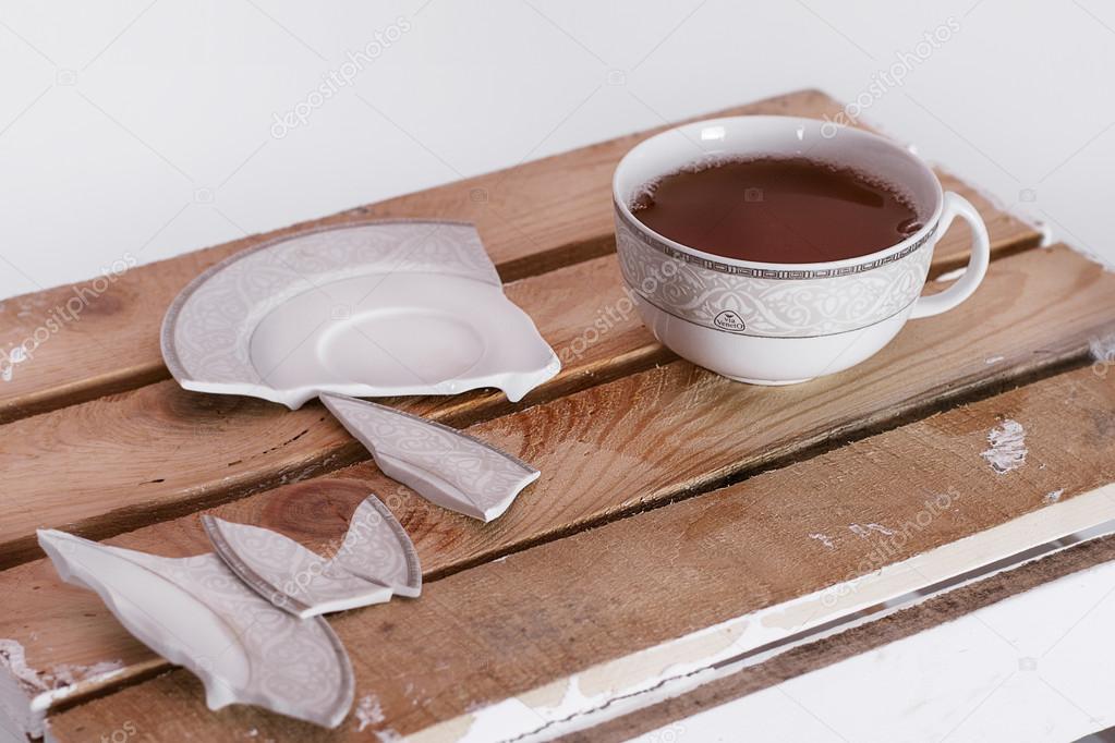 cup of tea and a broken saucer