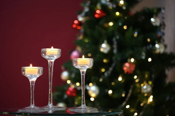 Tres velas encendidas en candelabros —  Fotos de Stock