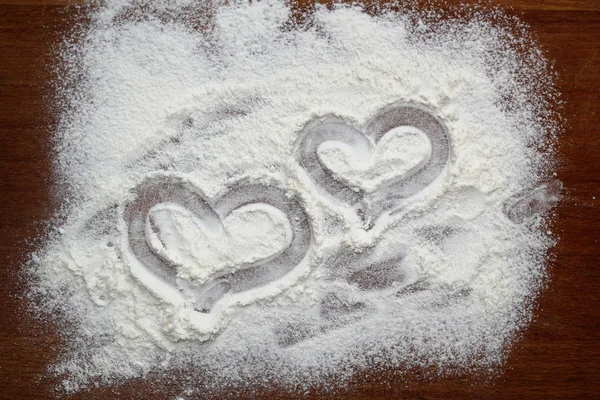 Drawing hearts in flour — Stock Photo, Image