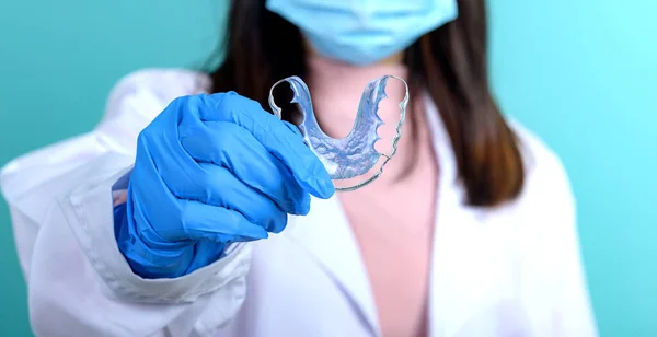 Dentist Woman Holding Orthodontic Retainer Blue Screen Background Dental Care Stock Image