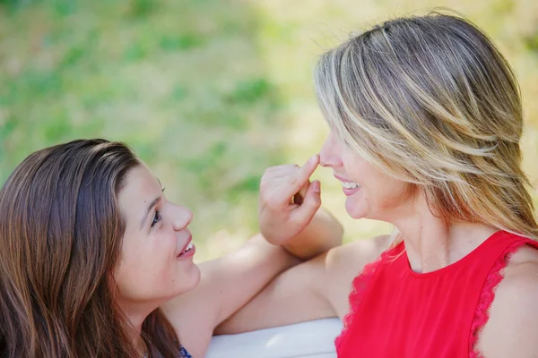 Mother and daughter hugging, smiling and sharing. Mothers day concept. Serenity and tranquility.